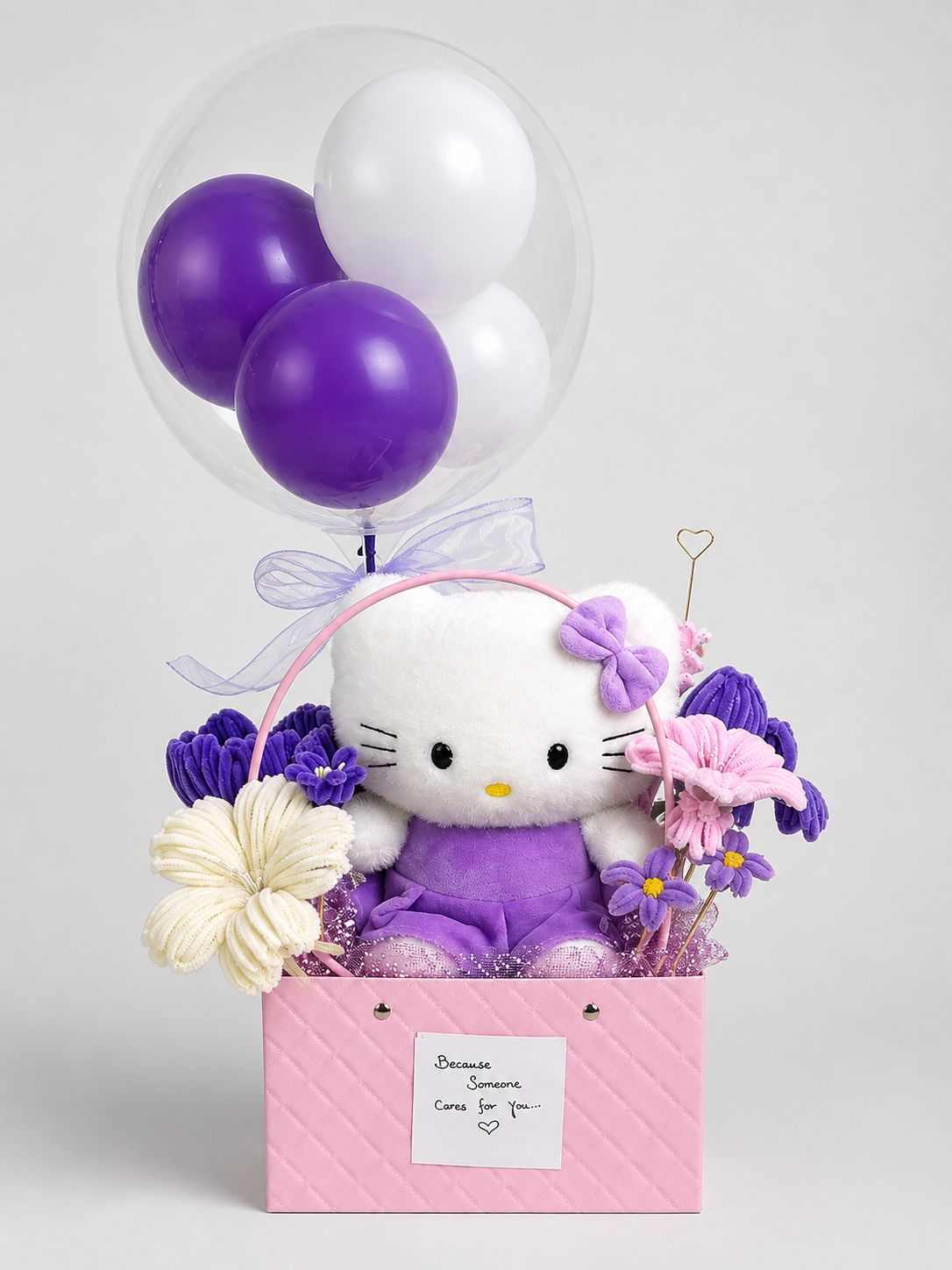 Purple Hello Kitty flower and balloon gift basket with cute plushie.