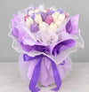 Purple tulip scented candle bouquet with luxury gift wrapping.