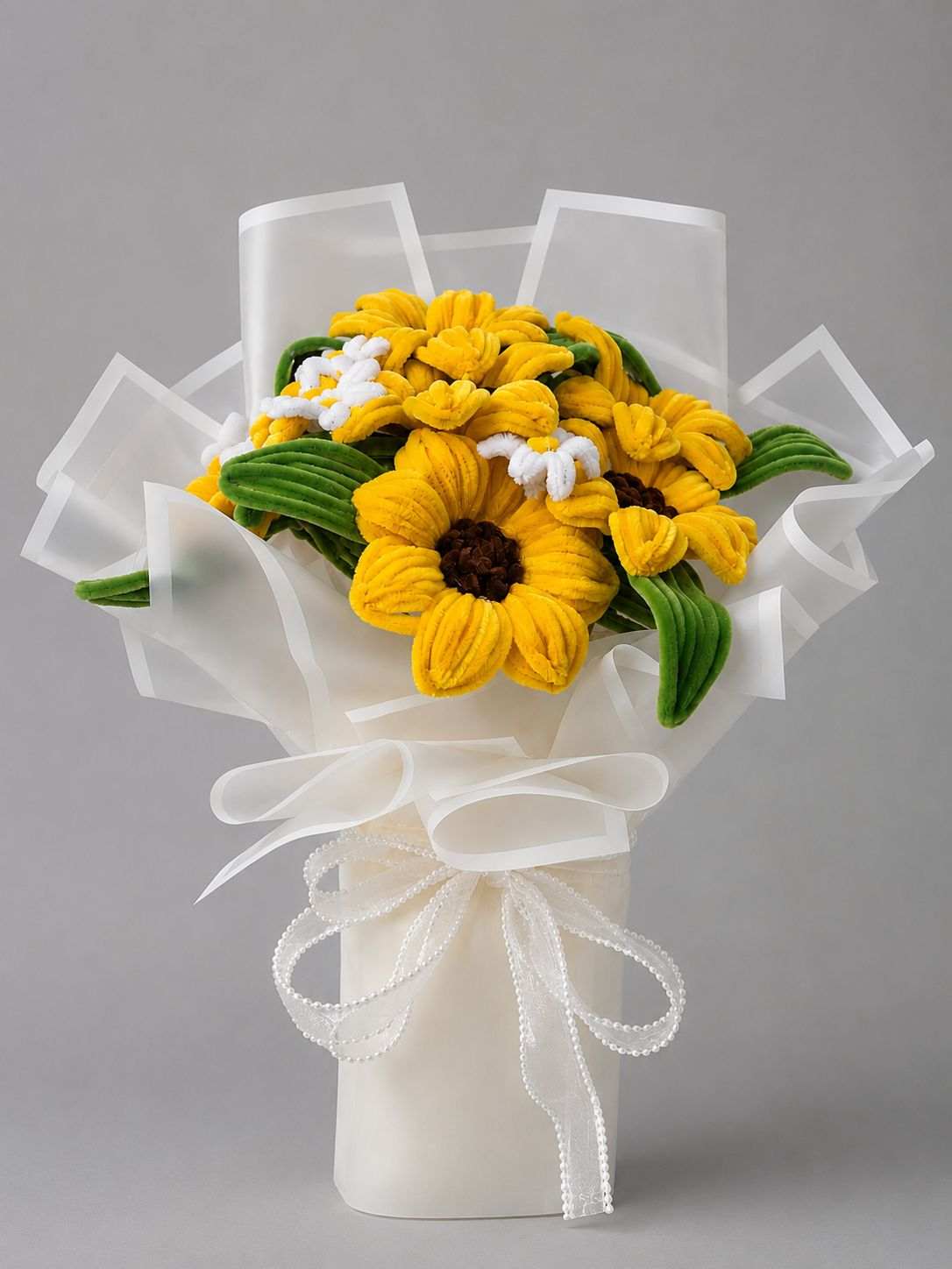 Sunflower floral bouquet with yellow flowers and elegant white wrapping.
