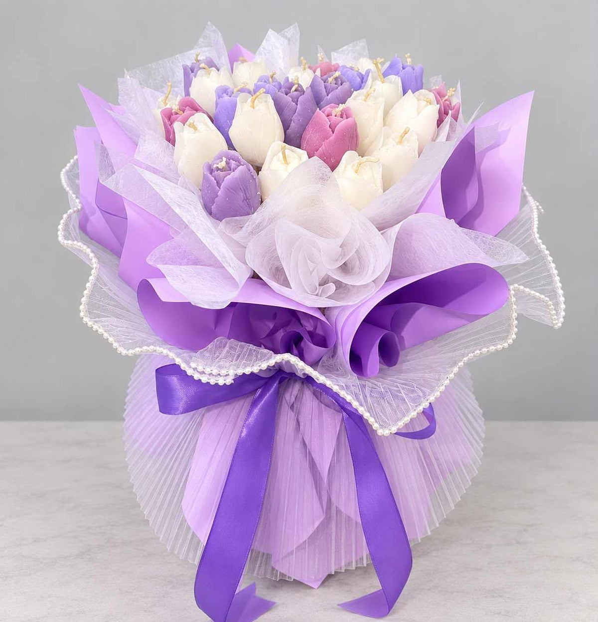 Purple tulip scented candle bouquet with luxury gift wrapping.